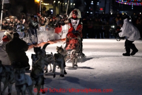 Aily Zirkle comes down Front Street with her team in Nome on Tuesday March 12, 2013.Iditarod Sled Dog Race 2013Photo by Jeff Schultz copyright 2013 DO NOT REPRODUCE WITHOUT PERMISSION