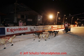 Ray Redington Jr. runs down the finish chute in Nome to place fifth on Wednesday March 13, 2013. Iditarod Sled Dog Race 2013Photo by Jeff Schultz copyright 2013 DO NOT REPRODUCE WITHOUT PERMISSION