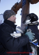 Thursday March 15, 2012   Martin Buser handler James Volek gets a high-ten from 