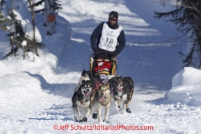 Sunday, March 4, 2012  Lance Mackey drops onto Long Lake at the restart of Iditarod 2012 in Willow, Alaska.