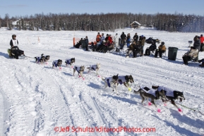 Sunday, March 4, 2012  Nicolas Petit passes a group of spectators on Long Lake at the restart of Iditarod 2012 in Willow, Alaska.